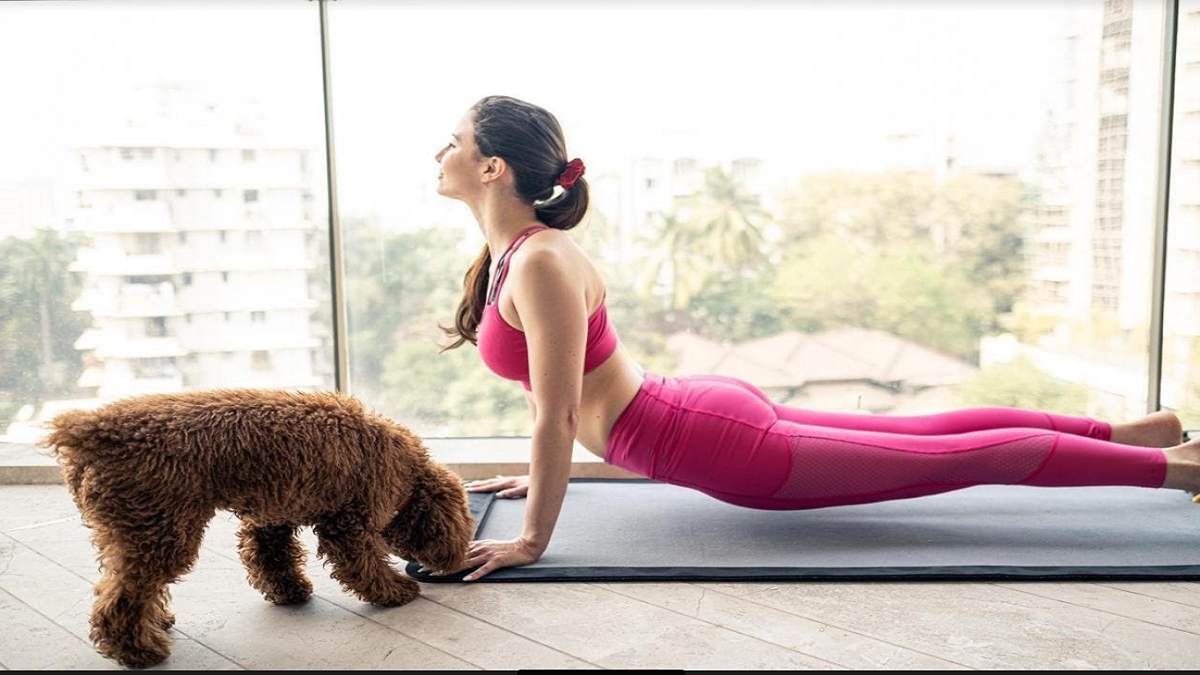 Andriani’s good mood mantra: Doing yoga with her pet