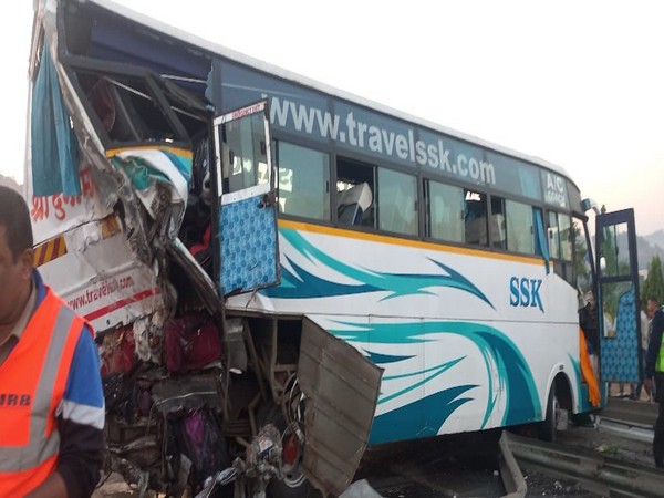 1 dead, 10 injured after private bus, container vehicle collide