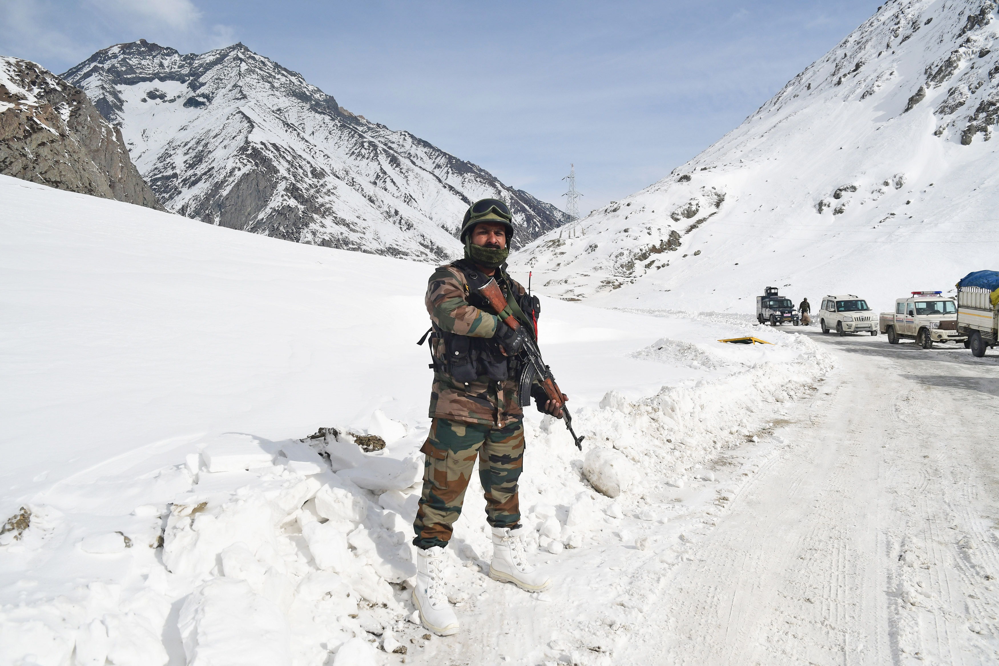 An Indian Army jawan stands guard on  Srinagar-Leh Highway