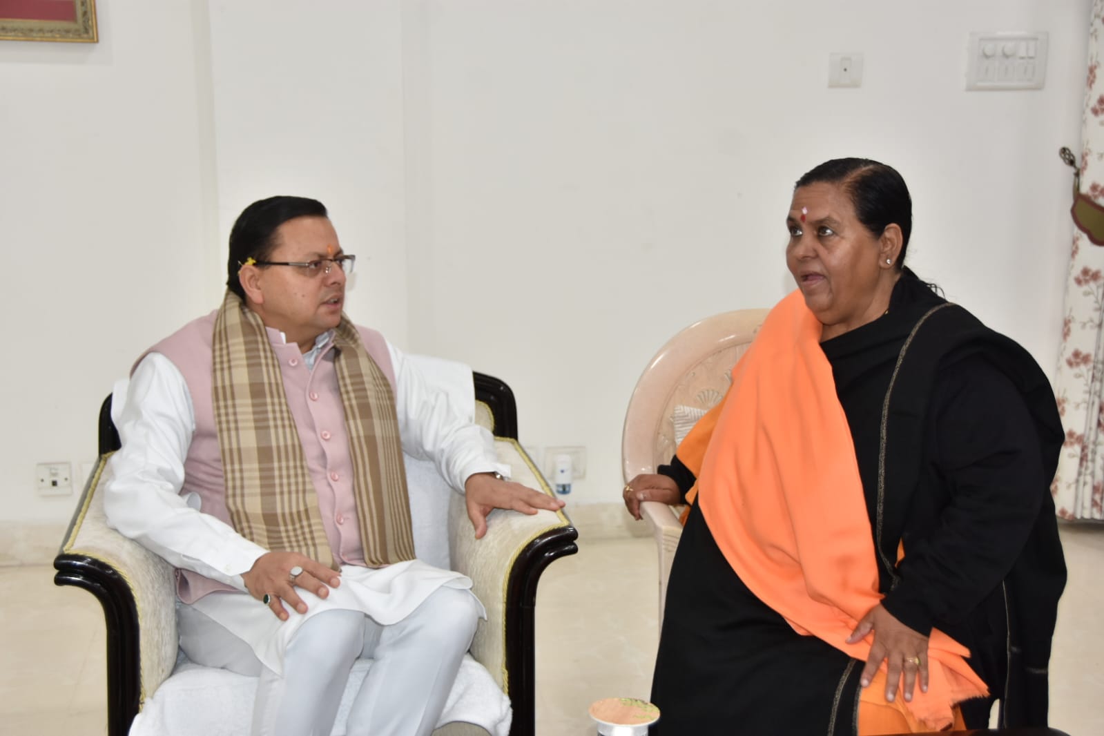 Uttarakhand CM Dhami meets former Madhya Pradesh CM Uma Bharti