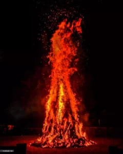 Devotees worship during the Holika Dahan