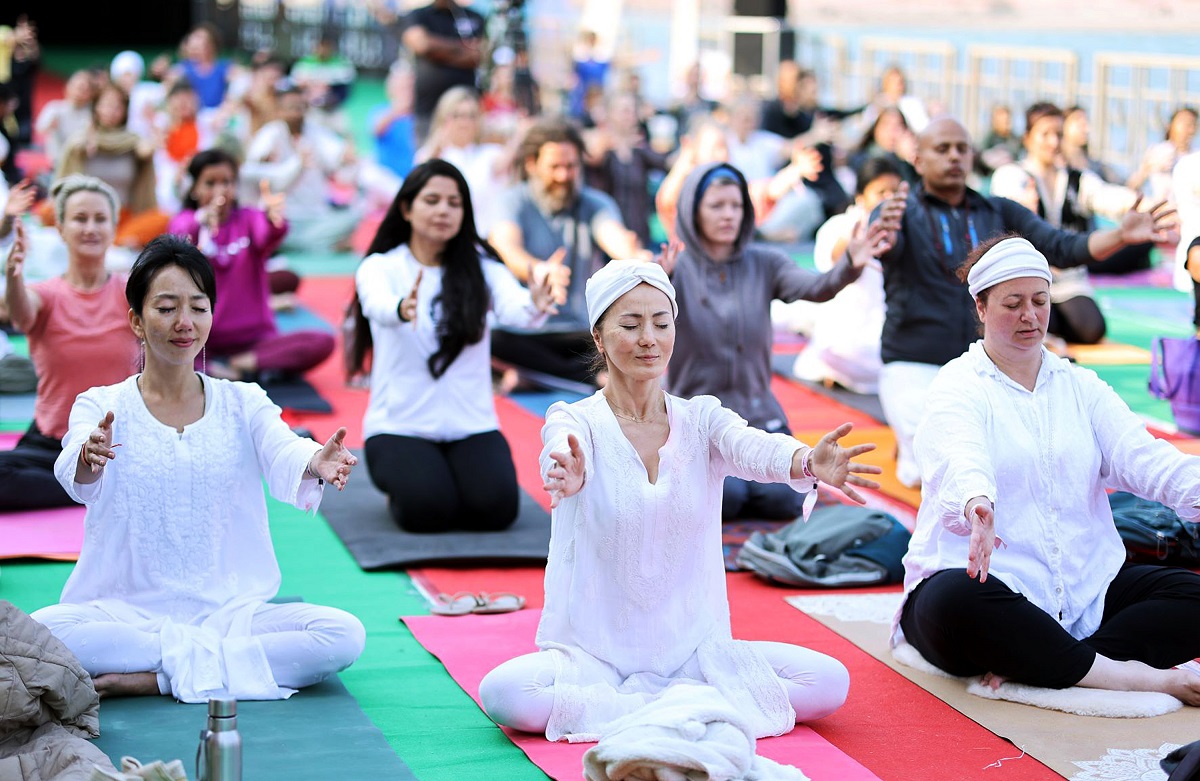 Foreigners perform Yoga during the 35th International Yoga Festival at Parmarth Niketan