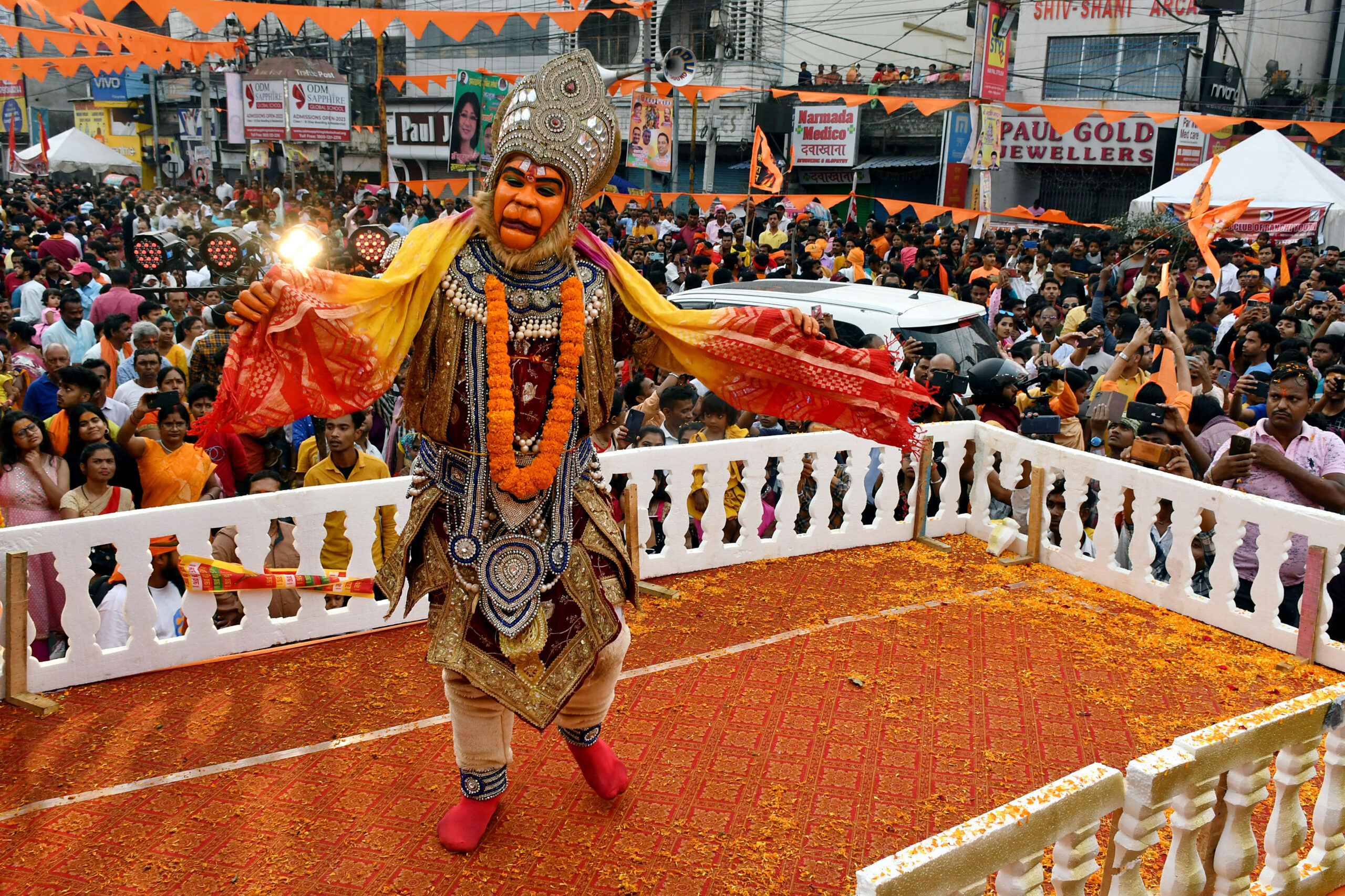 A devotee dressed as Lord Hanuman performs during the procession on the occasion of Ram Navami