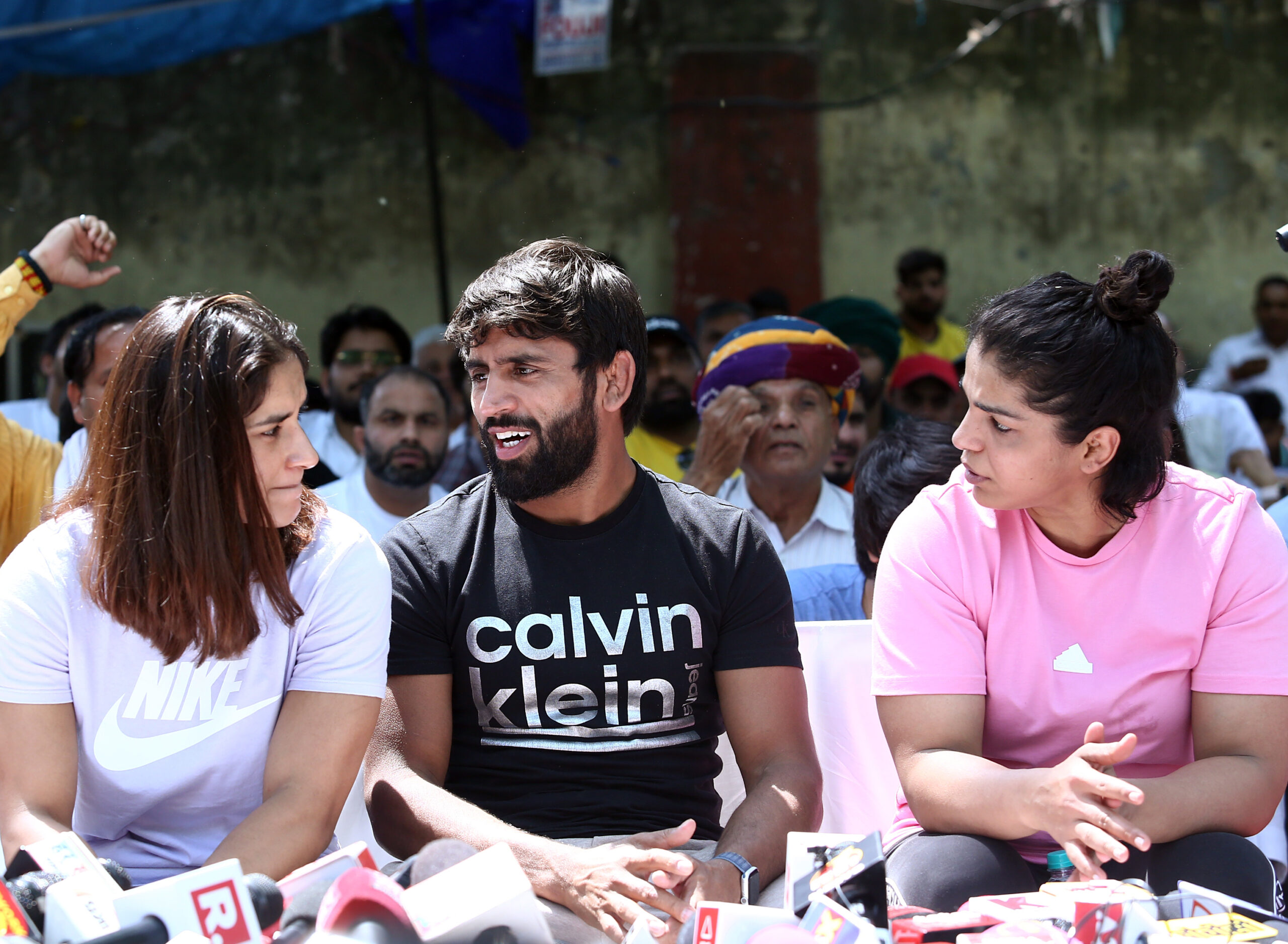 Indian wrestlers Bajrang Punia, Vinesh Phogat, and Sakshi Malik address the media during a protest against the Wrestling Federation of India. Chief Brij Bhushan Singh, at Jantar Mantar. 