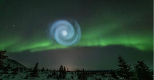 Odd spiral appears amid northern lights in Alaska night sky