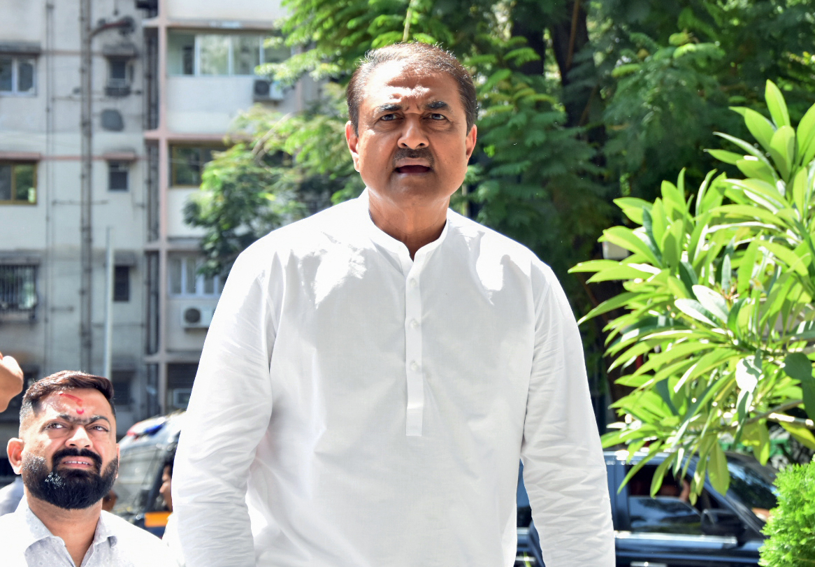 Praful Patel arrives to attend a meeting chaired by Sharad Pawar