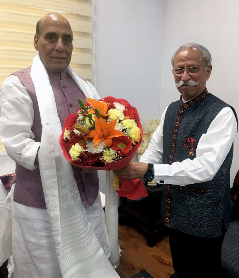 Union Defence Minister Rajnath Singh being felicitated by Lt. Gen (Retd) K T Patnaik, in New Delhi on Wednesday.