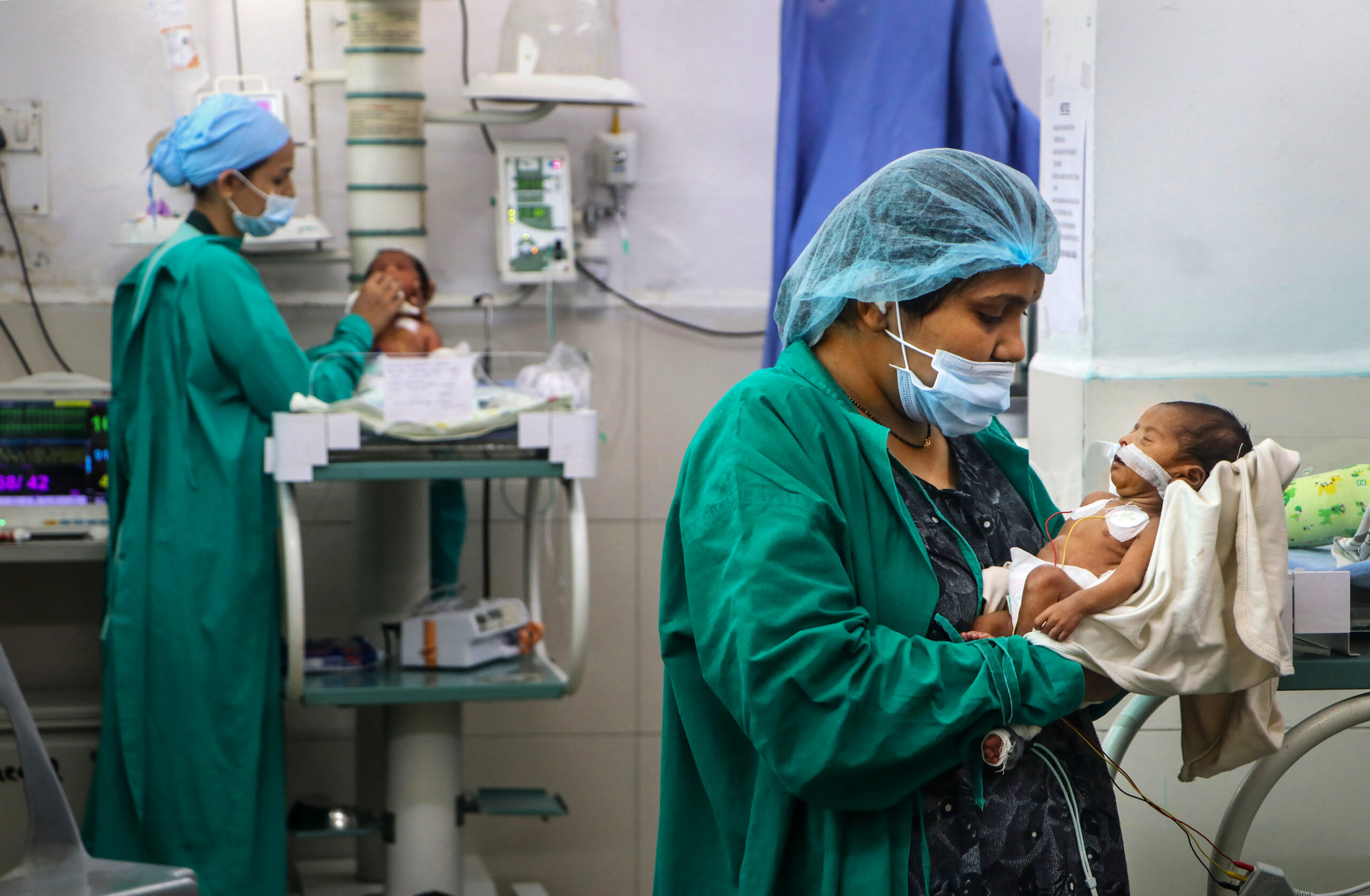 A woman holds her newborn baby at Lata Mangeshkar Hospital on the occasion of International Mother’s Day, in Nagpur on Sunday.