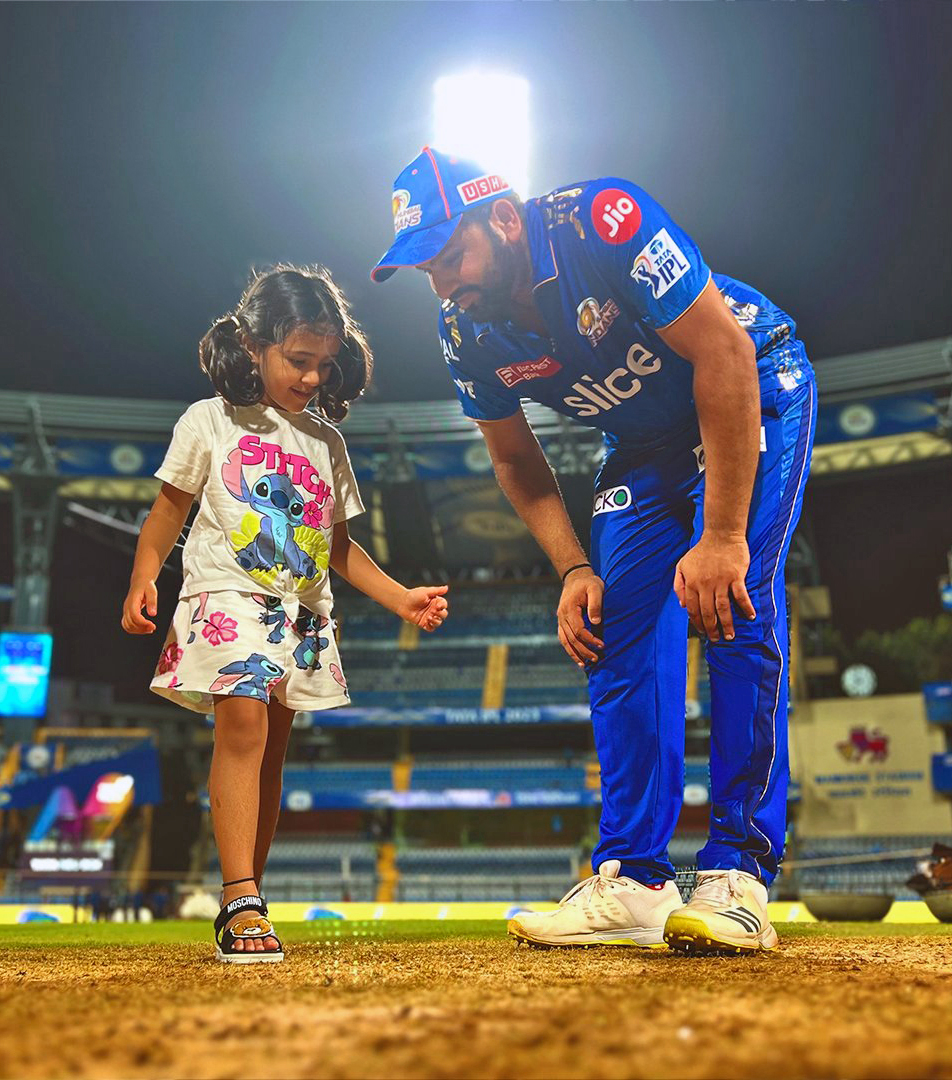 Mumbai Indians’ captain Rohit Sharma and his daughter take a pitch inspection at Wankhede Stadium