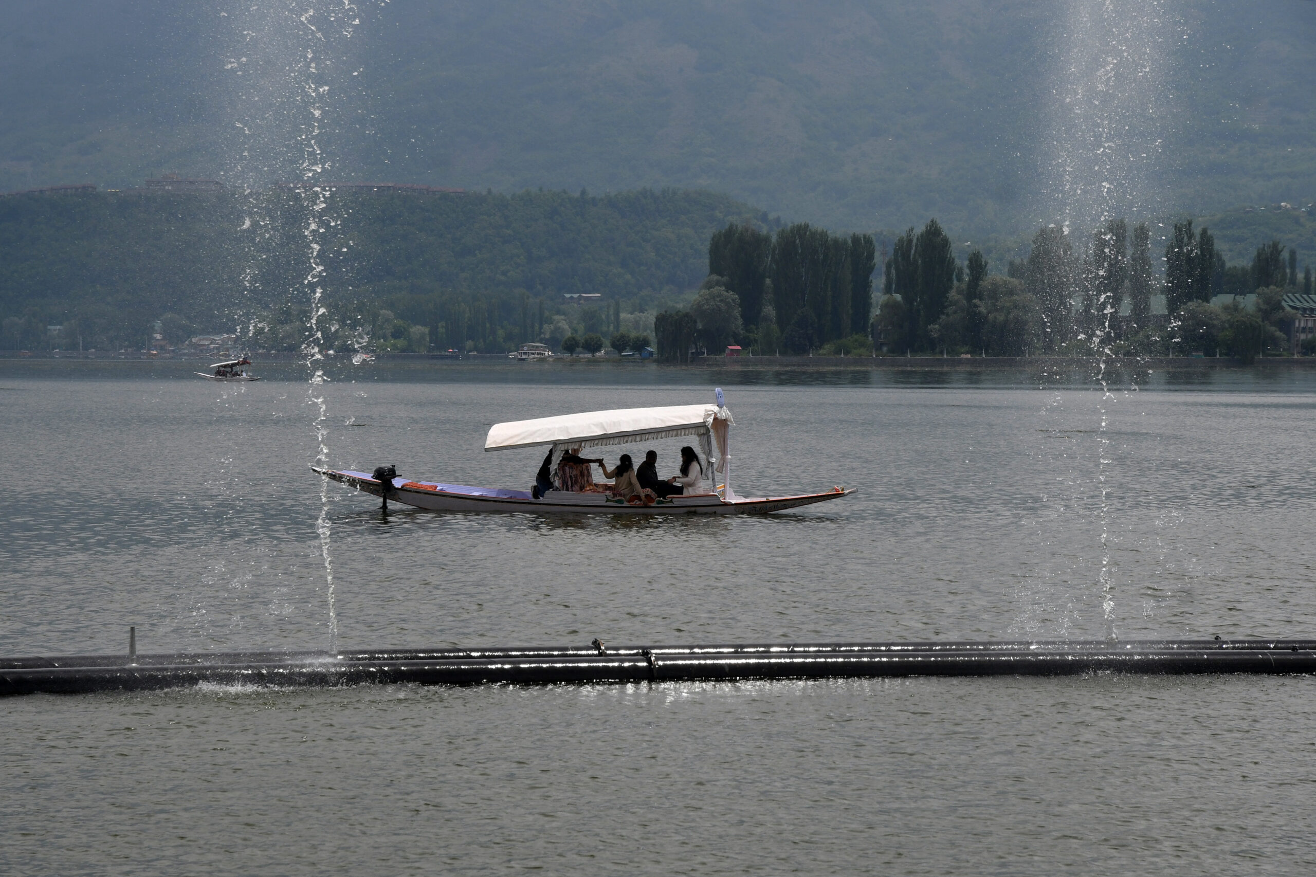 Tourists enjoy Shikara ride in the Dal Lake, in Srinagar