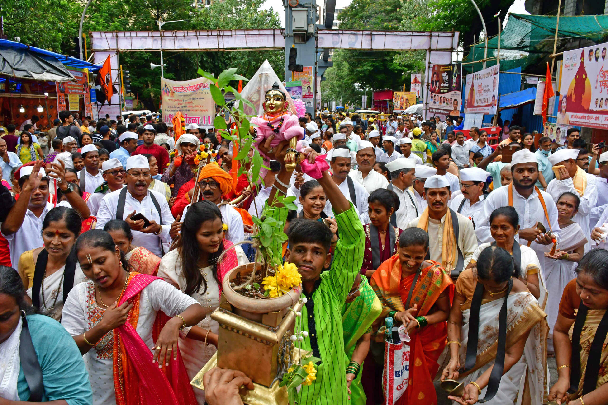 Devotees take out a religious procession on the occasion of Ashadhi Ekadashi