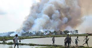 Mob firestorm engulfs abandoned homes amid escalating ethnic conflict