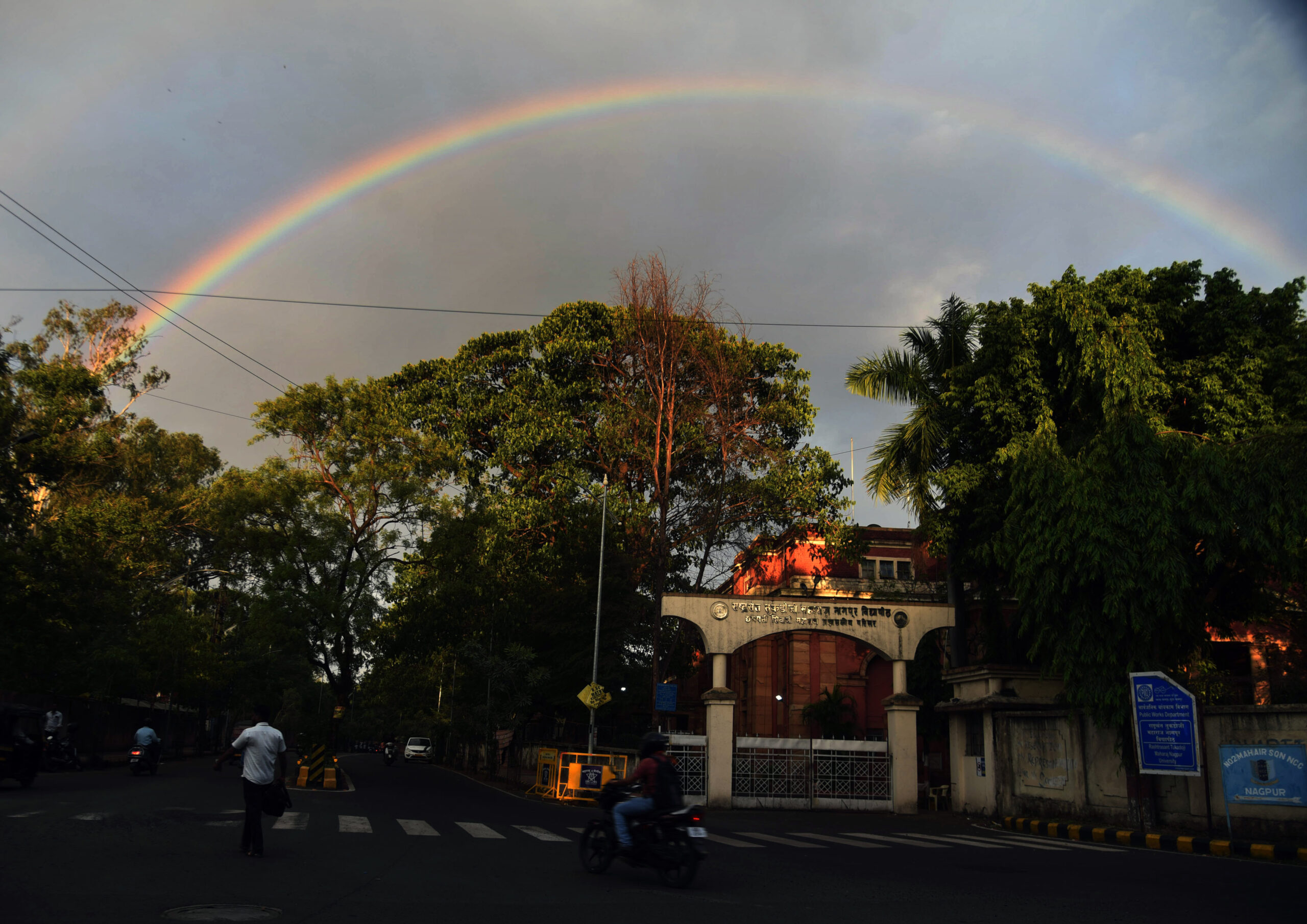 A rainbow appeared over the city during a rain shower