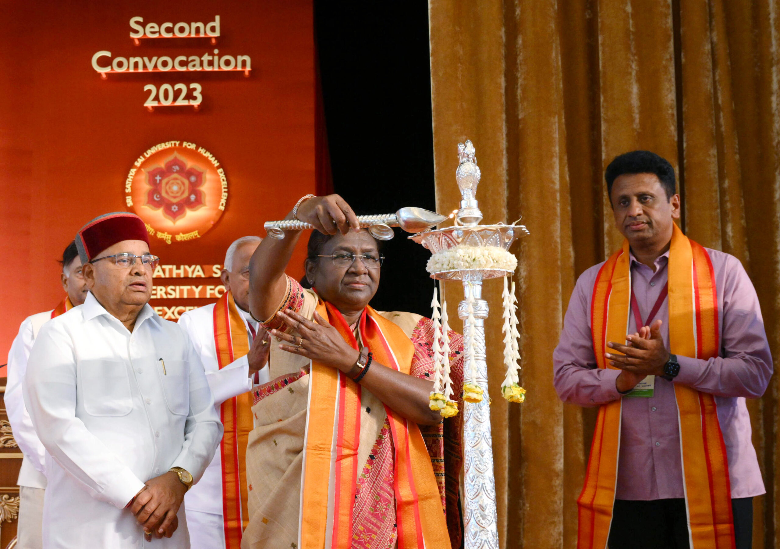 President Droupadi Murmu lights lamp during 2nd convocation of Sri Sathya Sai University