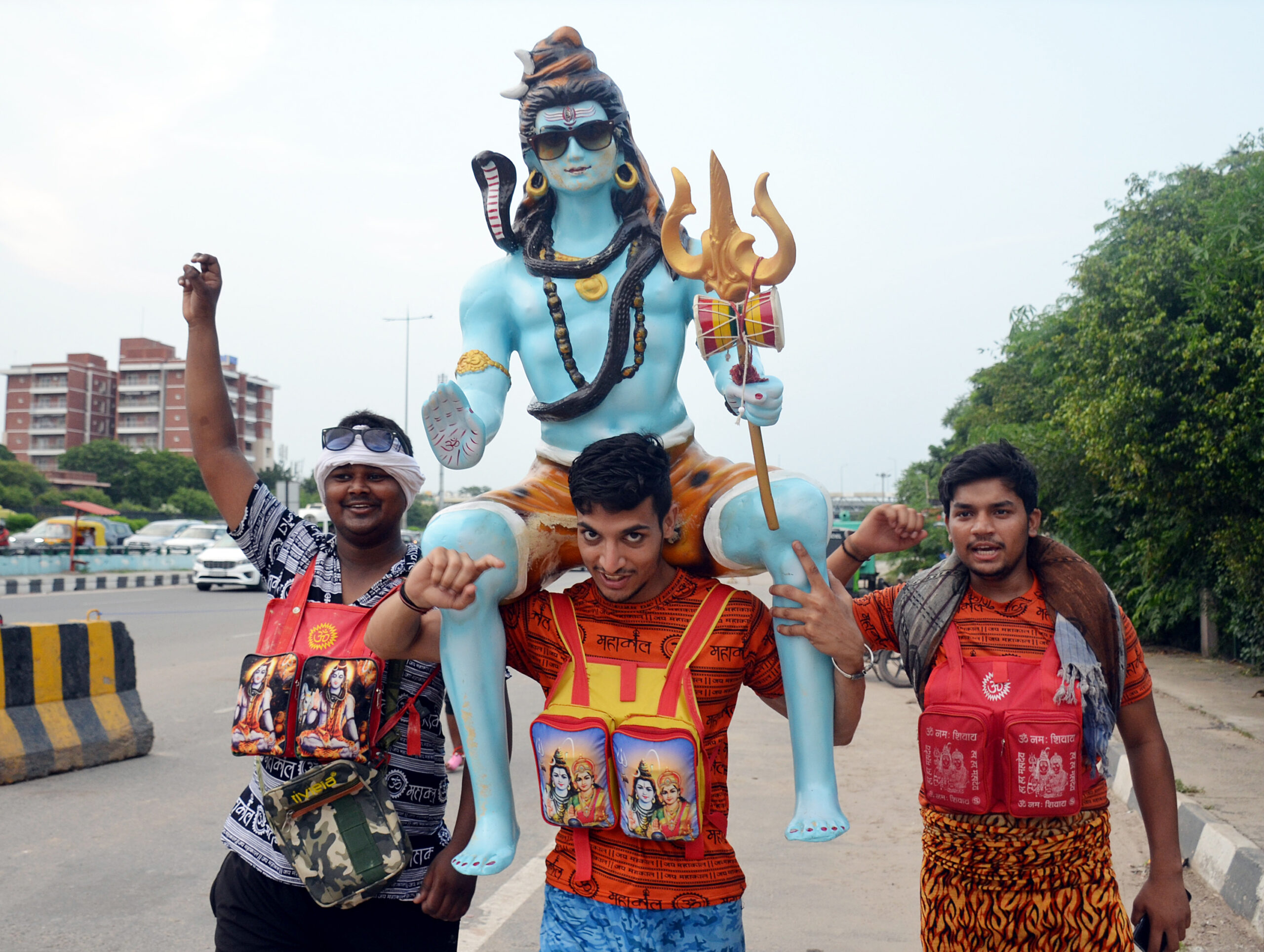 Kanwariyas carry an idol of Lord Shiva during Kanwar Yatra