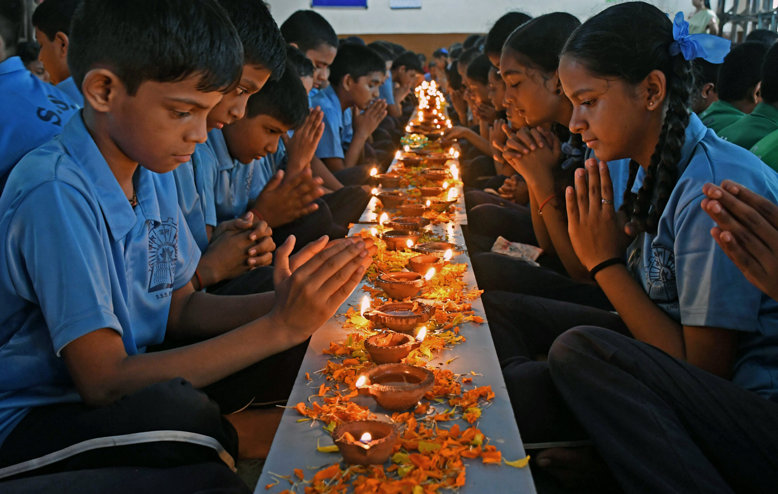 Students from Shivaji Shikshan Sanstha participate in Deep Pooja program on Ashadha Amavasya