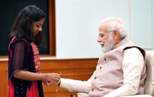 Delhi: Schoolgirls tie Rakhi to PM Narendra Modi on Raksha Bandhan