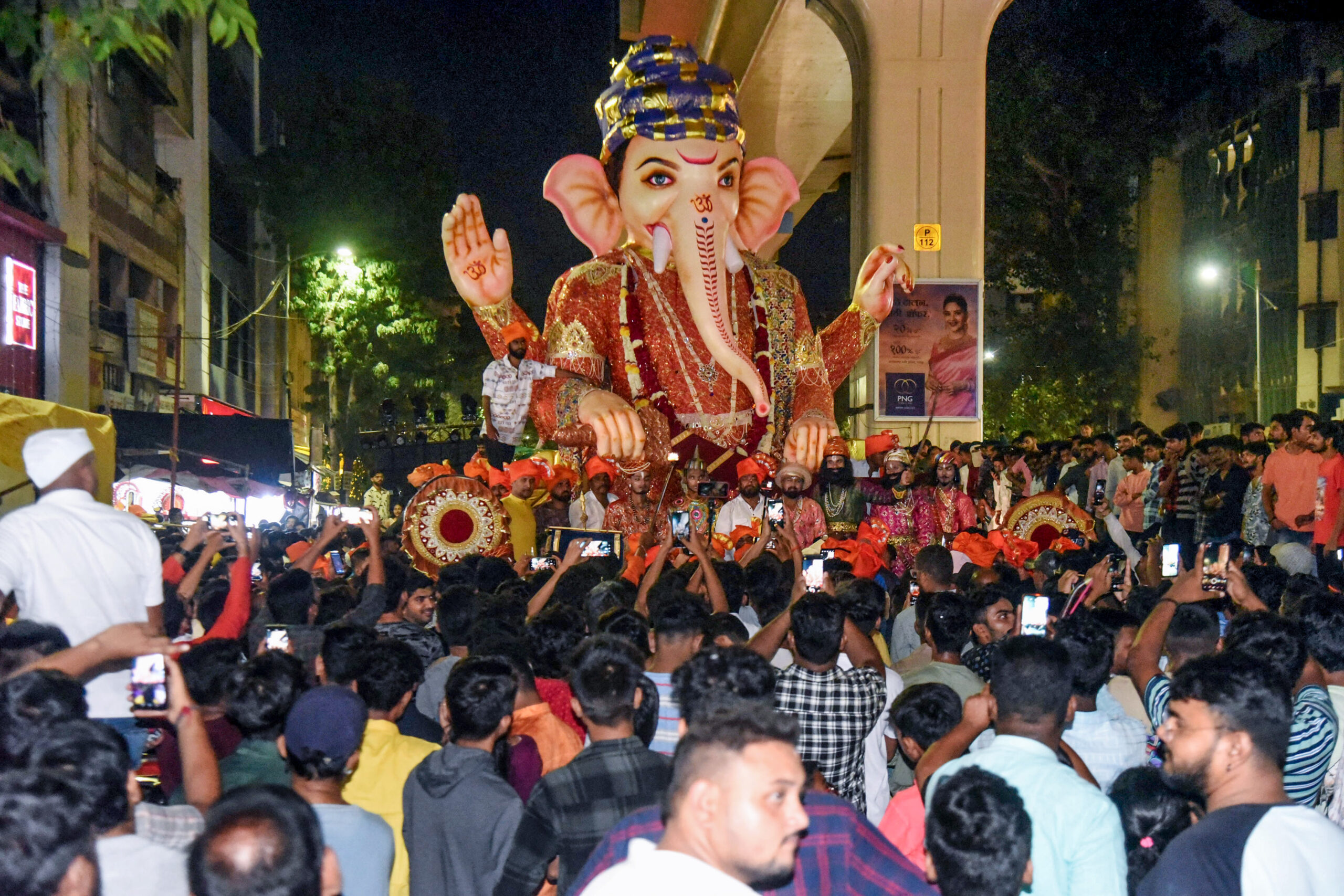 An idol of Lord Ganesha being carried during the procession on the first day of Ganesh Chaturthi celebrations