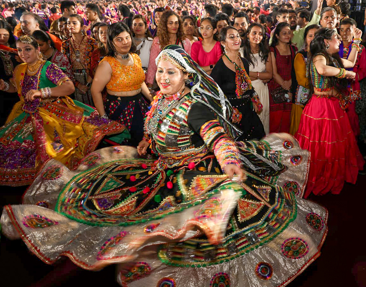 Women wearing traditional dresses perform Garba in Mumbai