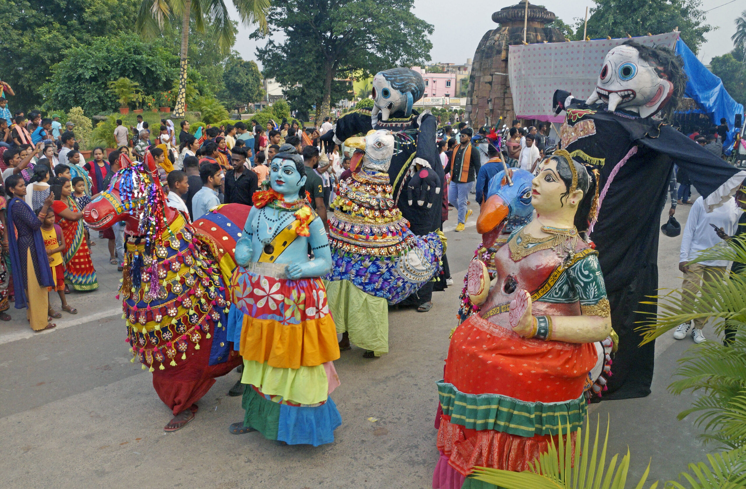 Artists performing a folk dance during the procession for the immersion of Goddess Durga after the culmination of the four-day long Durga Puja festival