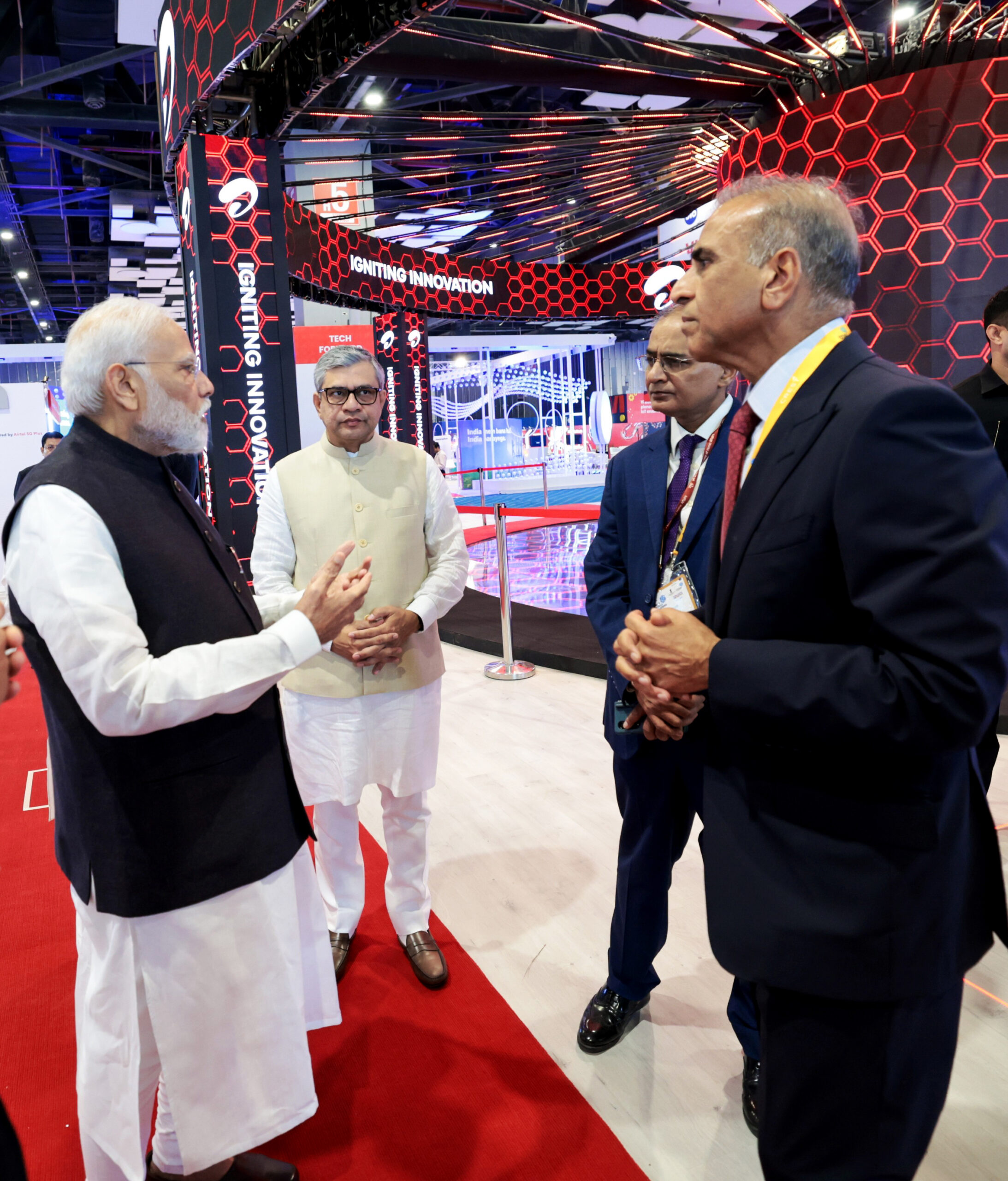 PM Narendra Modi visits an exhibition during the inauguration of the 7th edition of the India Mobile Congress