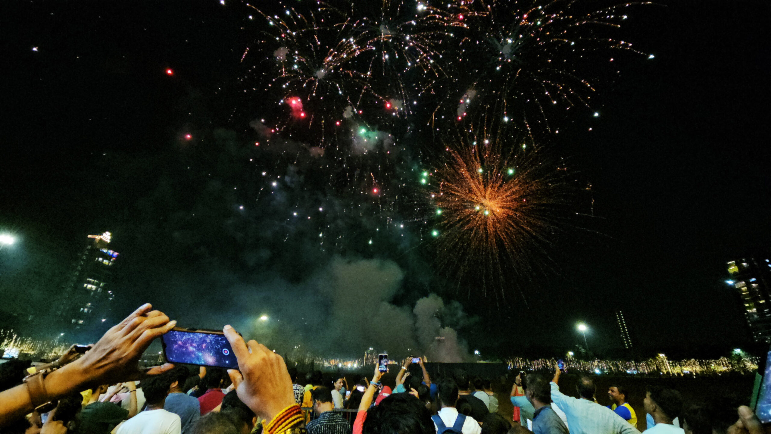 People burst firecrackers ahead of the Diwali festival