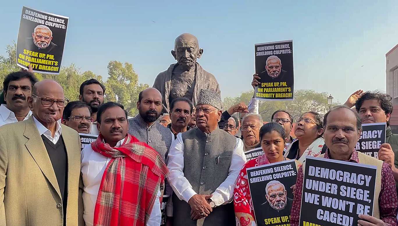 LoP in RS Mallikarjun Kharge and other opposition MPs stage a protest in front of Gandhi Statue at Parliament House following the suspension of 92 MPs for the remainder of the ongoing Winter Session