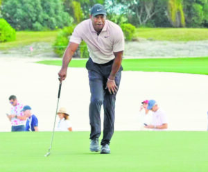 Woods admits soreness; Harman, Finau lead day one