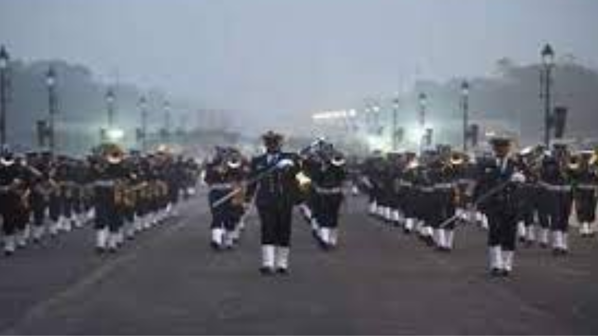 Soldiers march to drumbeats during dress rehearsals in chilly weather for 75th Republic Day parade