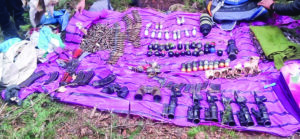 Security forces recover large cache of arms and ammunition in Kupwara forest