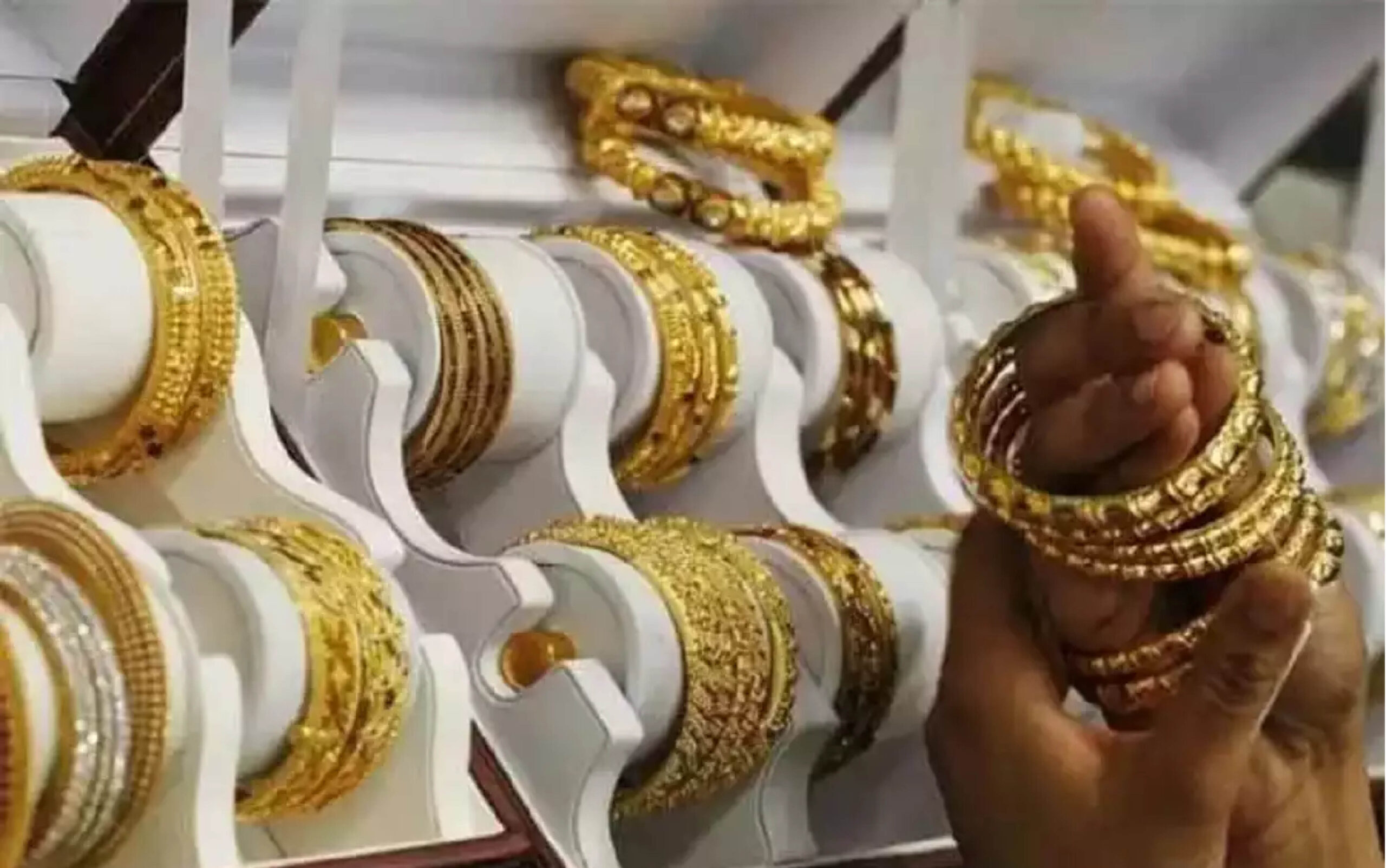 Gold prices pull back modestly after record surge