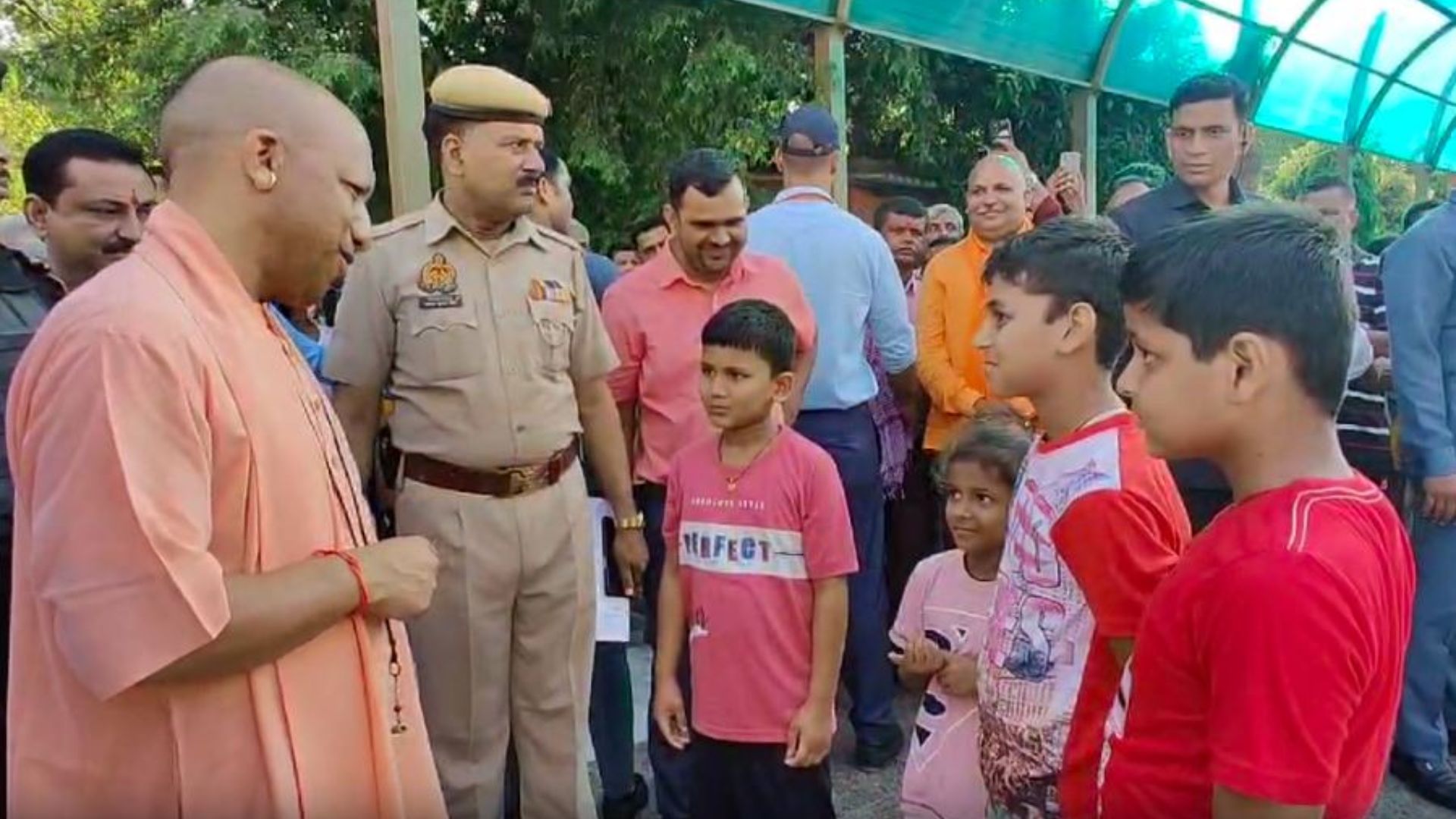 CM Yogi Delights Children With Chocolates During Gorakhpur Temple Tour
