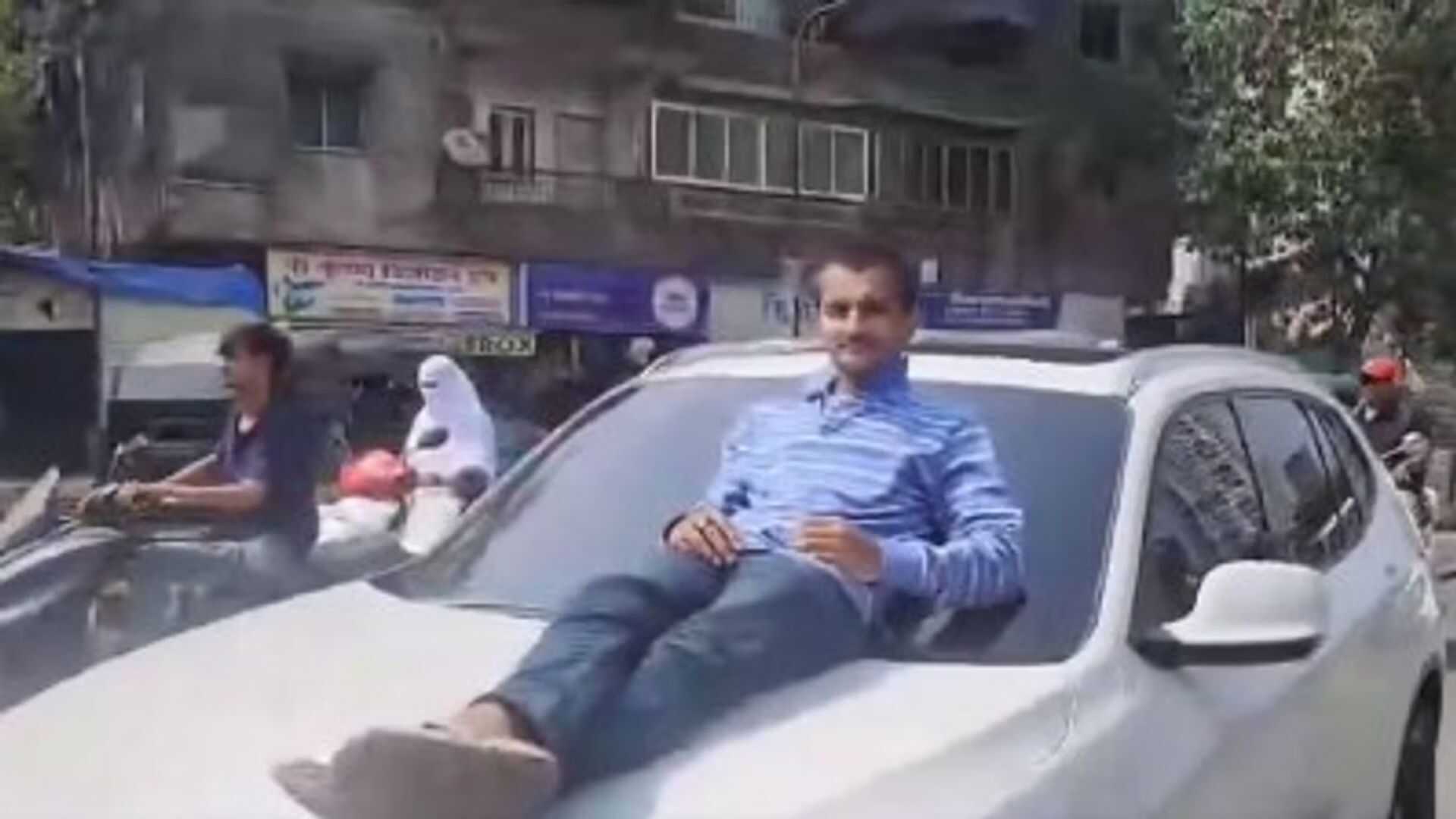 Teen Caught Driving BMW Without License With Man On Bonnet In Kalyan; Case Registered