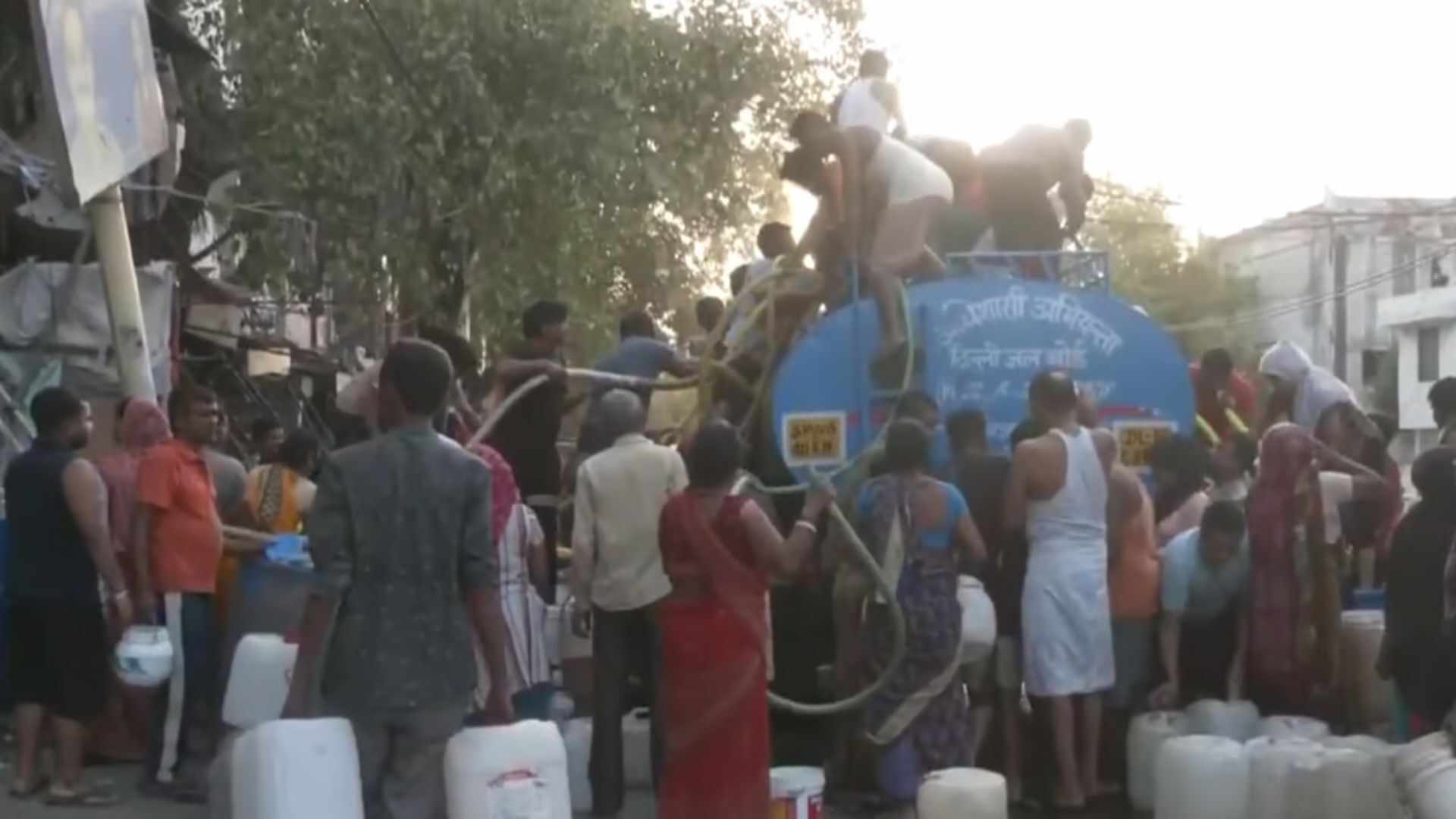 Watch: Delhiites Stand In Front Of Water Tankers With Cans & Buckets