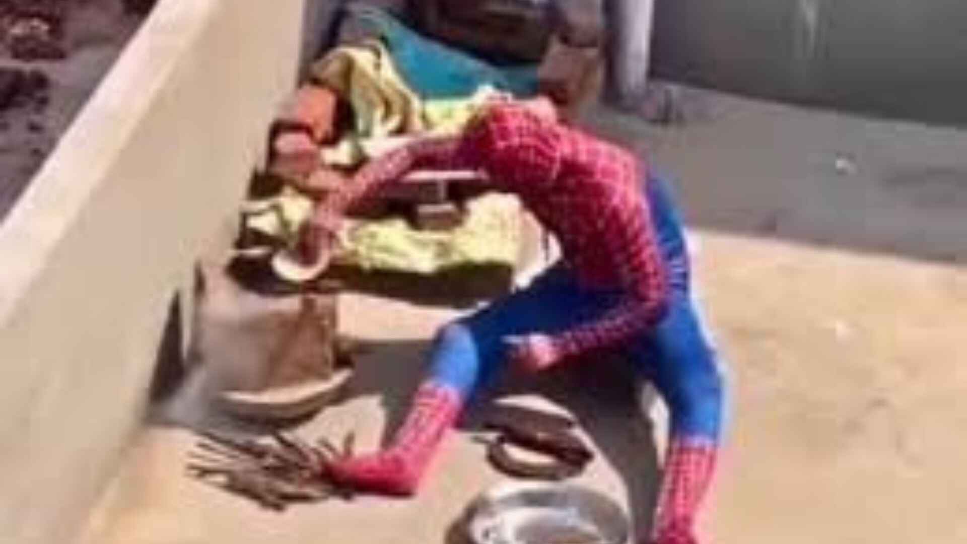Man in Spider-Man costume makes roti