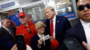 Trump Delights Young Fan In Wig & Suit With Photo-Op, Autographed $20 Bill