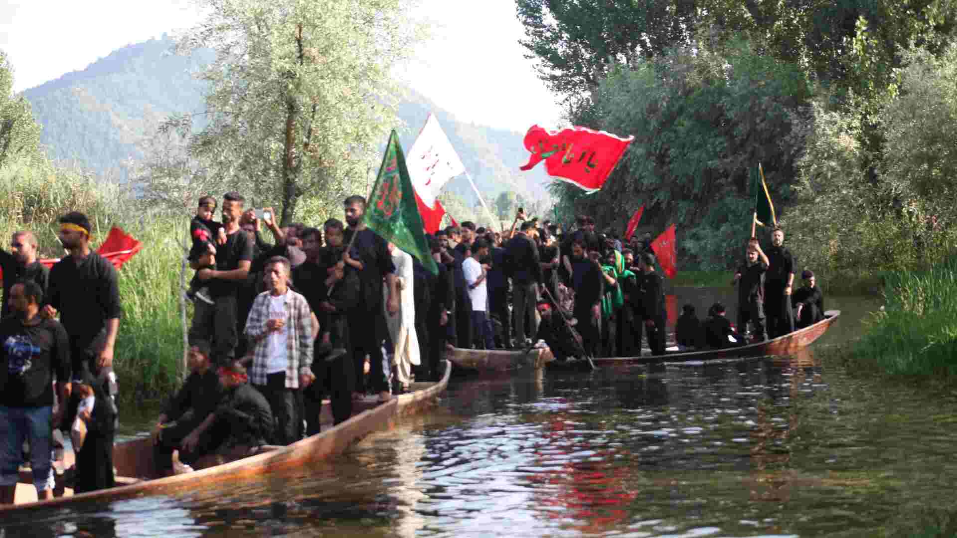 Tranquil Waters: Muharram Procession Glides Over Dal Lake In Srinagar.