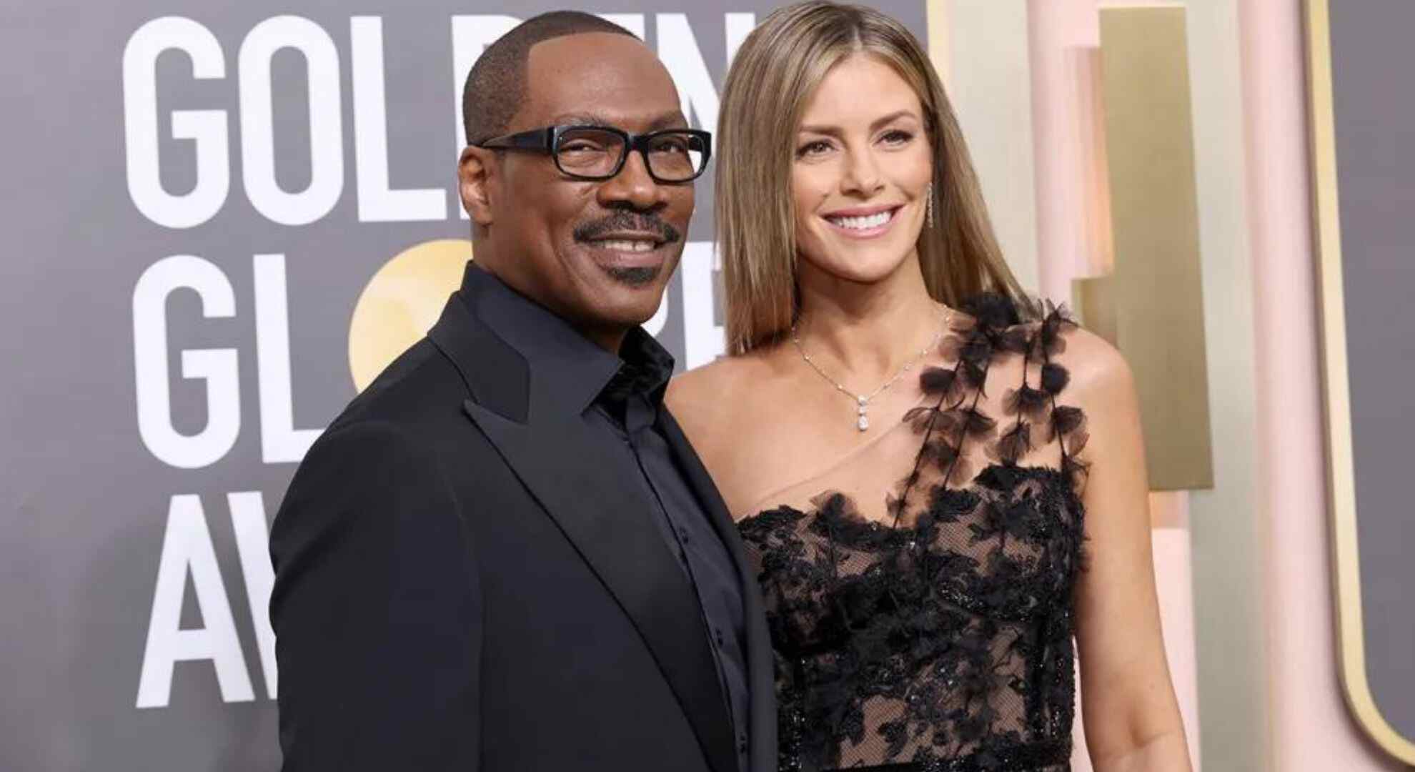 Eddie Murphy and Paige Butcher embrace after their private wedding ceremony in Anguilla.