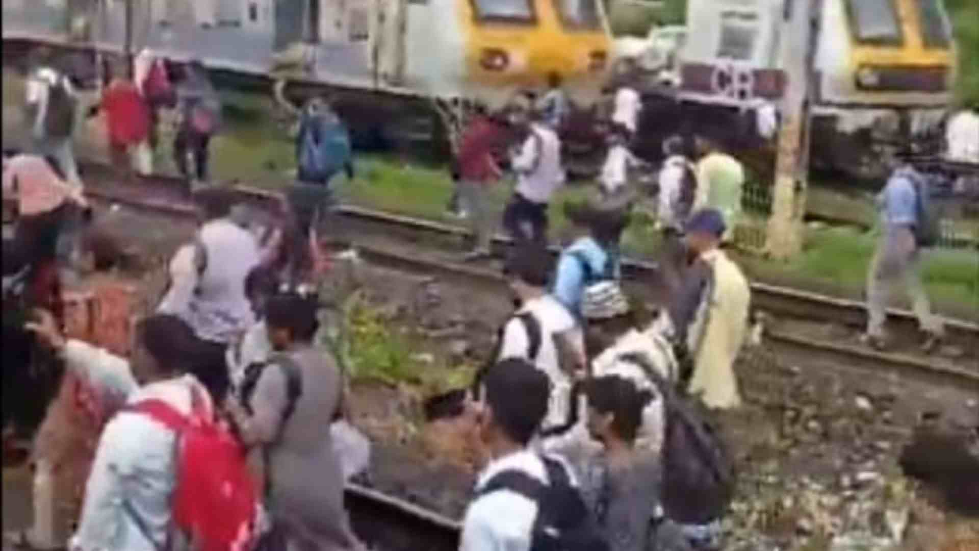 Mumbai: Travellers Walk On Railway Tracks Following Failure Of Local Train Service