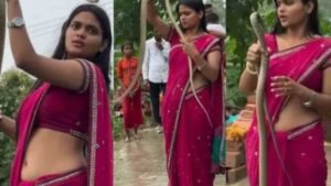 Watch: Girl In Red Saree Poses Fearlessly With Giant Snake Wrapped Around Her Body