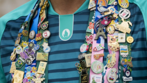 Pin Trading At The Paris Games: The Olympic Tradition From 19th Century You Need To Know About -Watch Here