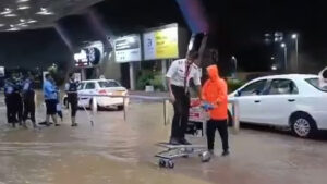 Airport or Water-Port?: Viral Video Shows Pilot Entering Jaipur Airport on Luggage Trolley Amid Flooding – WATCH