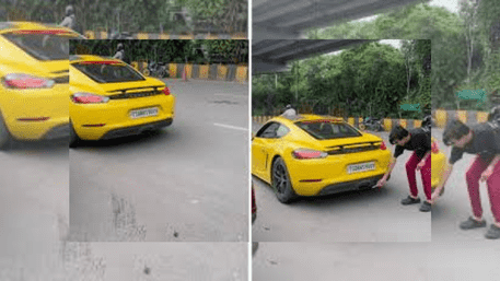 Man Lighting Cigarette With Porsche Exhaust