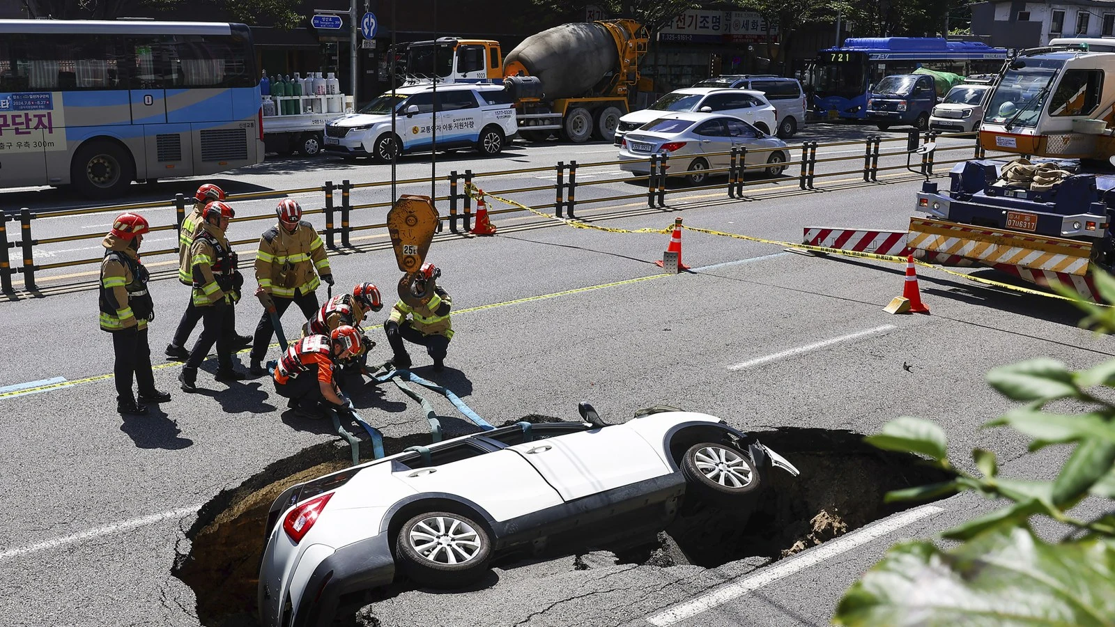 Sinkhole Swallows SUV: Elderly Passengers Injured in Dramatic Incident in Seoul