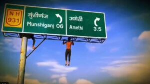 Watch: Man Takes Pull-Up Challenge To New Heights On Road Signboard