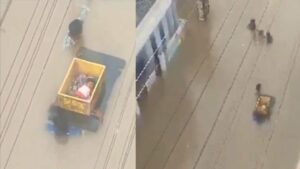 2 Men Carry Baby In Crate Through Neck-Deep Floodwaters In Vijayawada | Watch