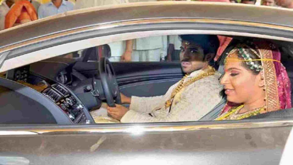 Ram Charan with his wife in Aston Martin Vantage V8