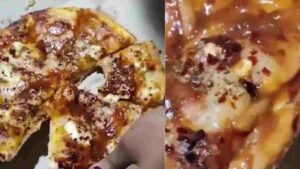 Live Worms Spotted on Restaurant Pizza in Viral Video | WATCH