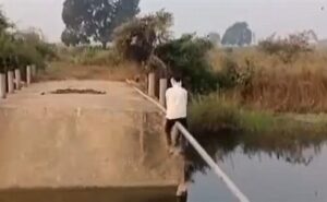 Telangana Villager Crosses Stream On Pipe After Bridge Collapse