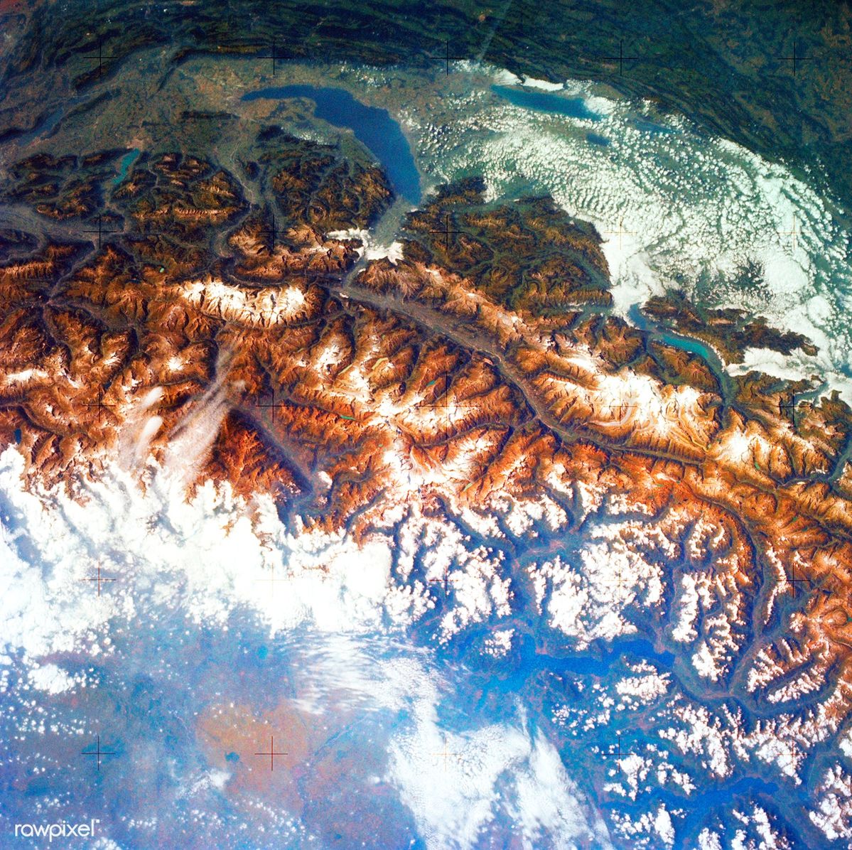 Snowcapped Alps seen through a veil of clouds - Photo Gallery